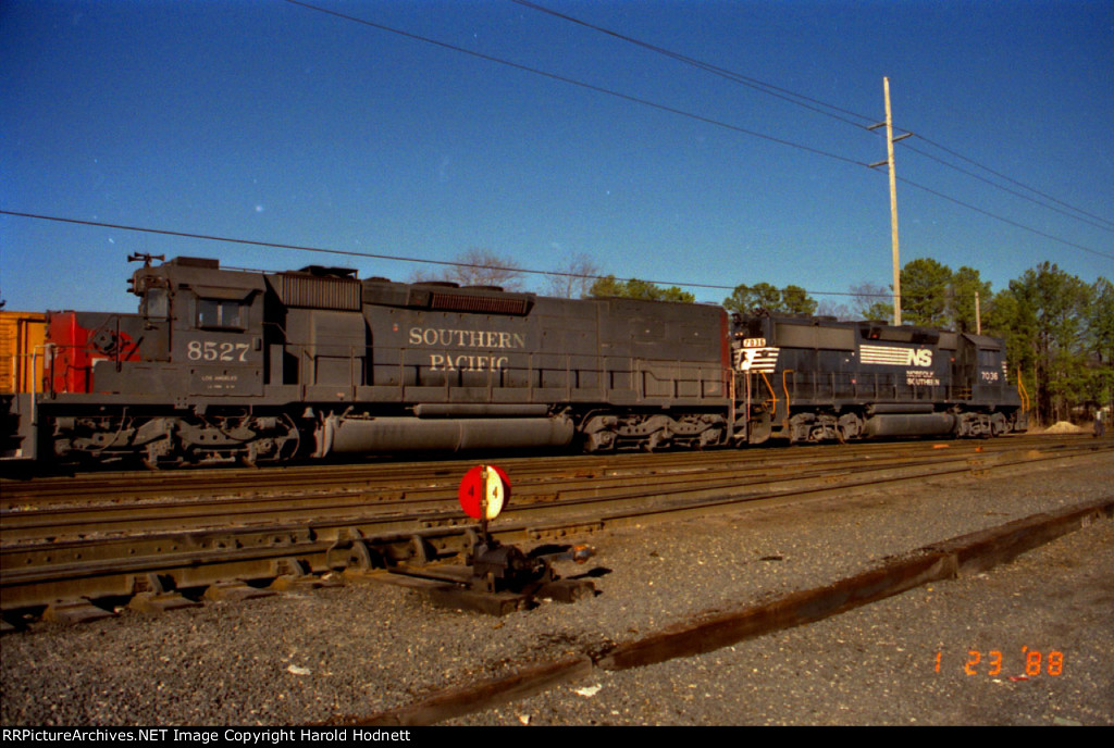 NS 7036 leads SP 8527 thru the yard